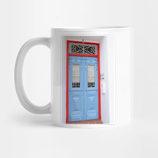 building entrance with blue door Mug